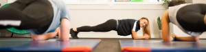 A photo taken from floor height of a pilates class